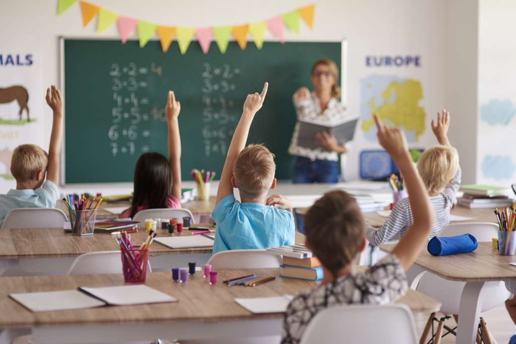 raised hands in a classroom