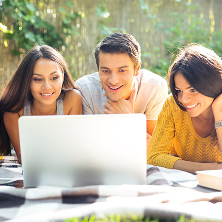 Friends around a laptop