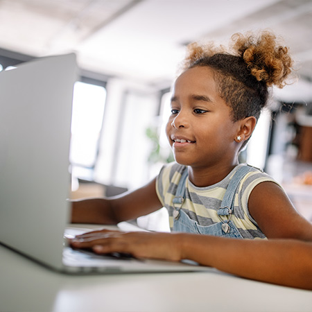 Young girl using laptop