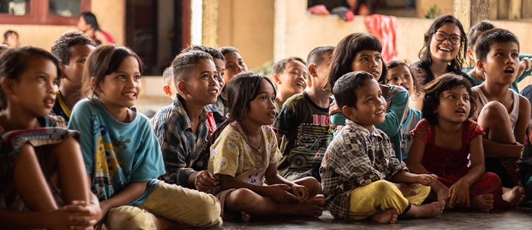 Children listening to teacher