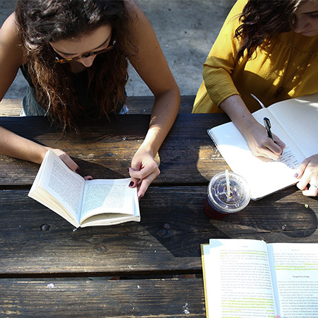 Friends sat down reading together