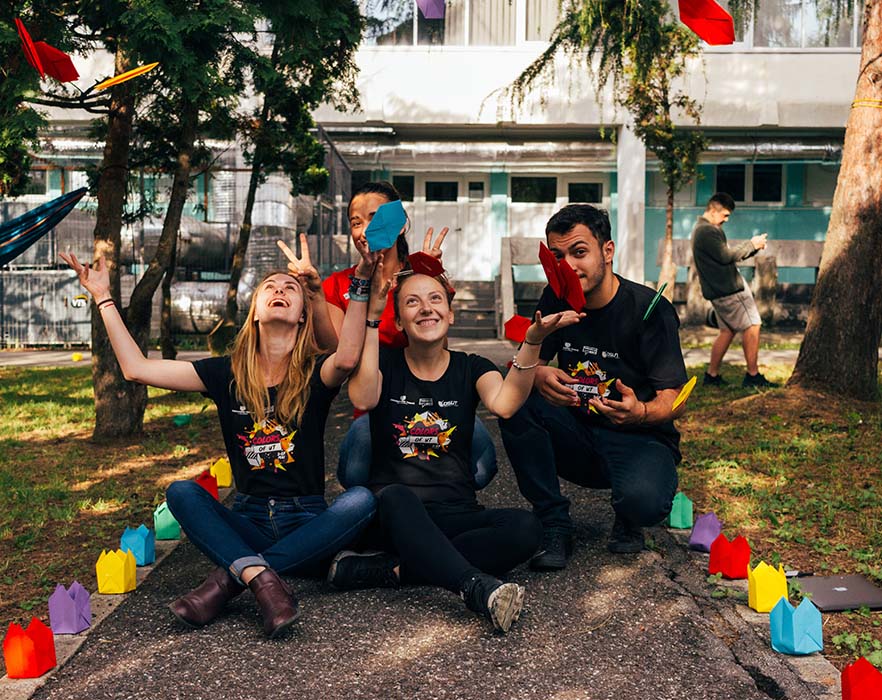 TEFL teachers sat on the floor smiling