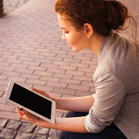 Woman using iPad tablet