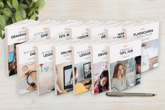 lots of book spread out on a table