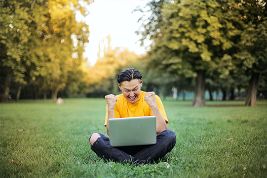 happy man on laptop