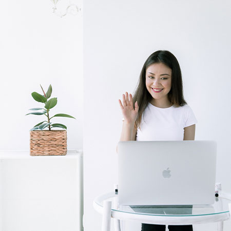 girl using laptop to teach English online