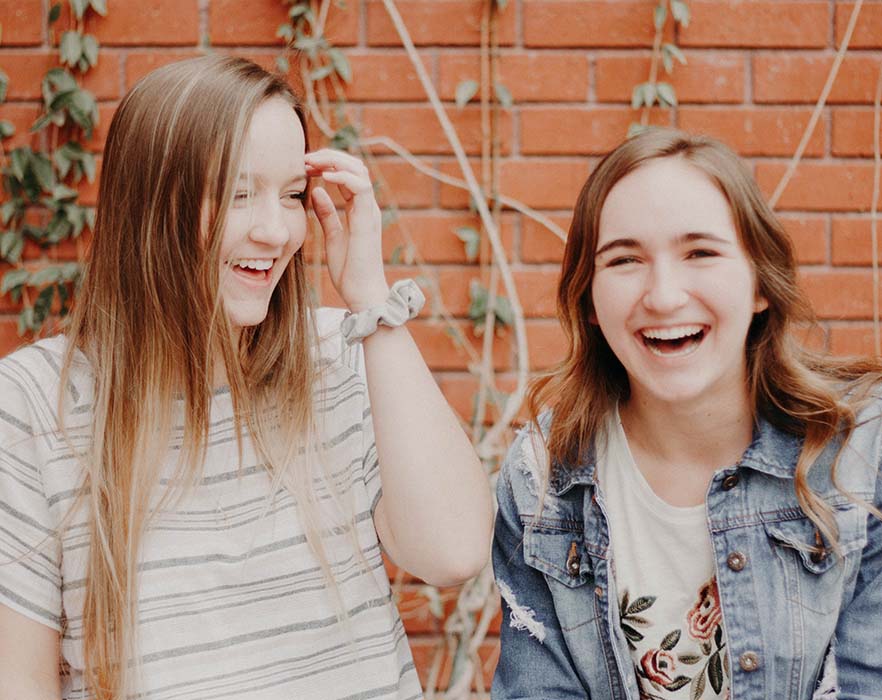 two girls smiling