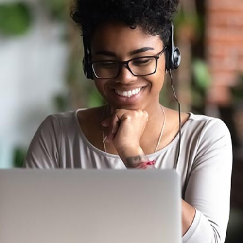 woman smiling at laptop