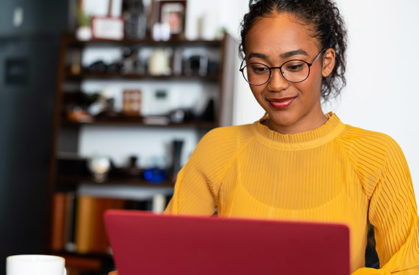 woman typing on laptop