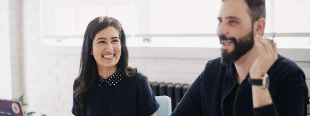 woman and man laughing together