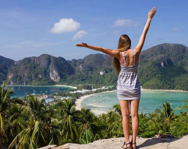 girl looking over bay