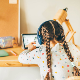 girl using ipad for TEFL lesson