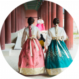 two south korean women in dresses