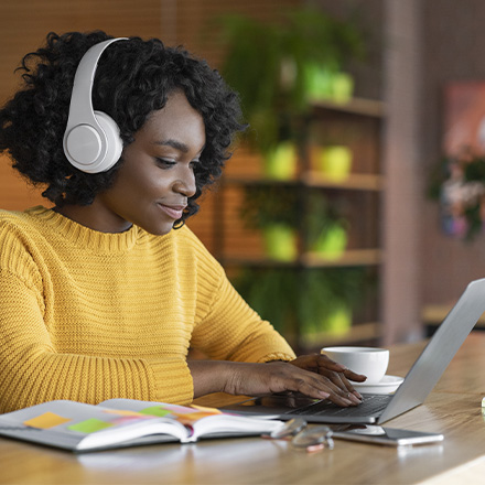 Woman sat at laptop