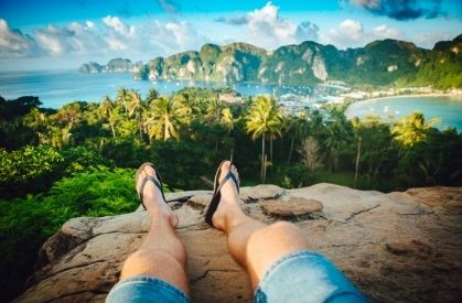 Man looking out over Thailand bay