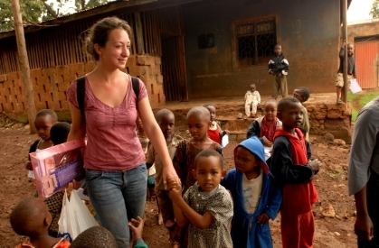 TFEL teacher with students in africa