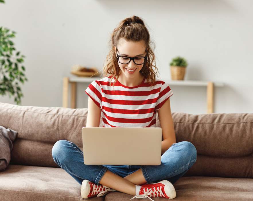 woman smiling at laptop