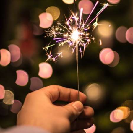 winter celebration sparkler in hand