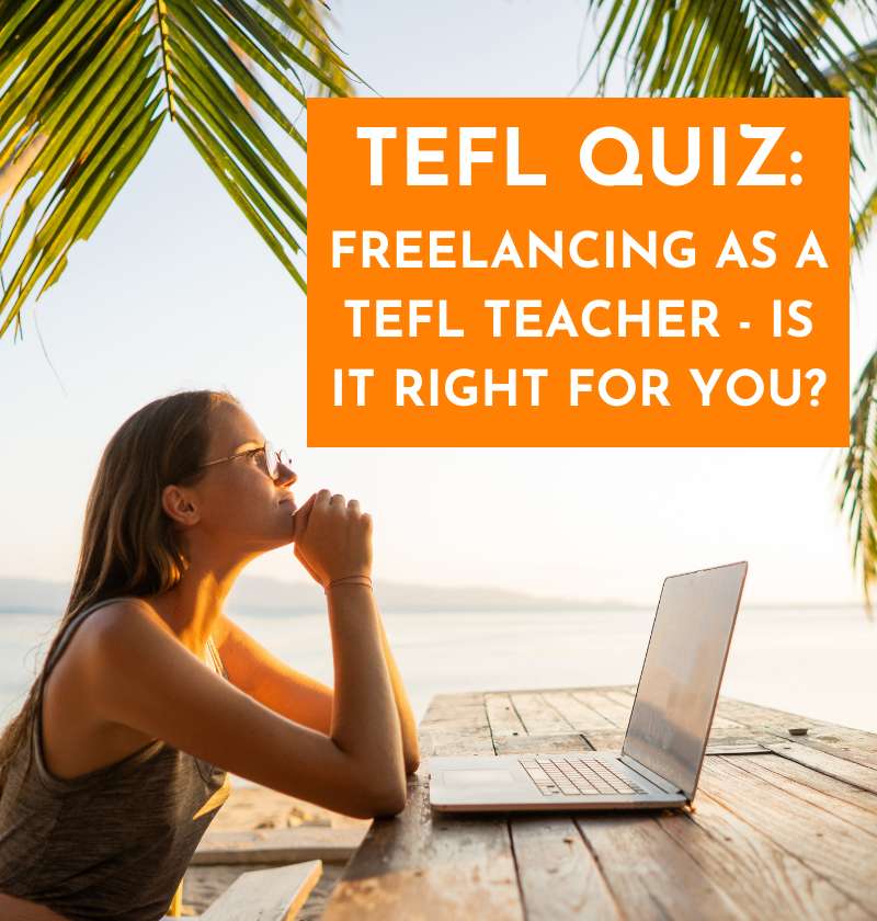 WOMAN ON LAPTOP AT THE BEACH