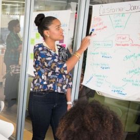 woman teaching on whiteboard