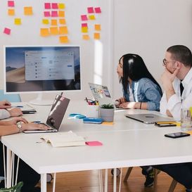 people having a meeting around a table