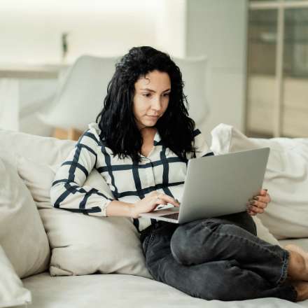 woman looking at laptop