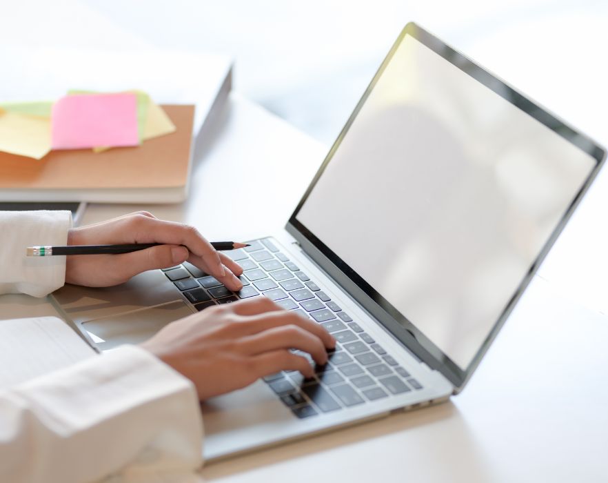 WOMAN WORKING ON COMPUTER