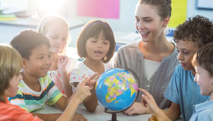 FEMALE TEACHER WITH GLOBE