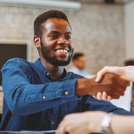 man smiling and handshake