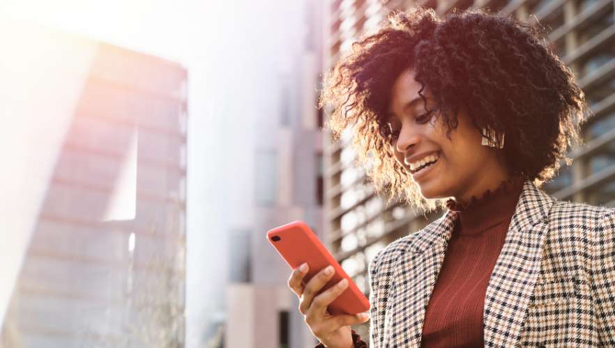 woman smiling at phone